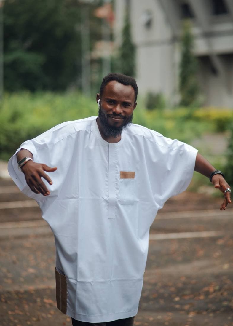 White agbada-lite, arms raised