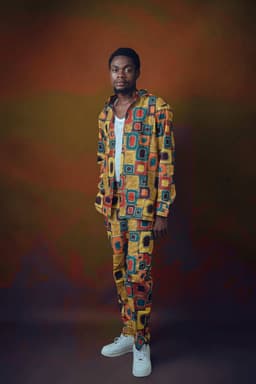 The geometric-print agbada-lite two-piece being made for this order