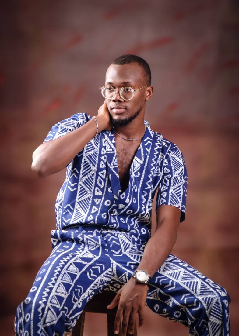 Indigo adire two-piece, seated