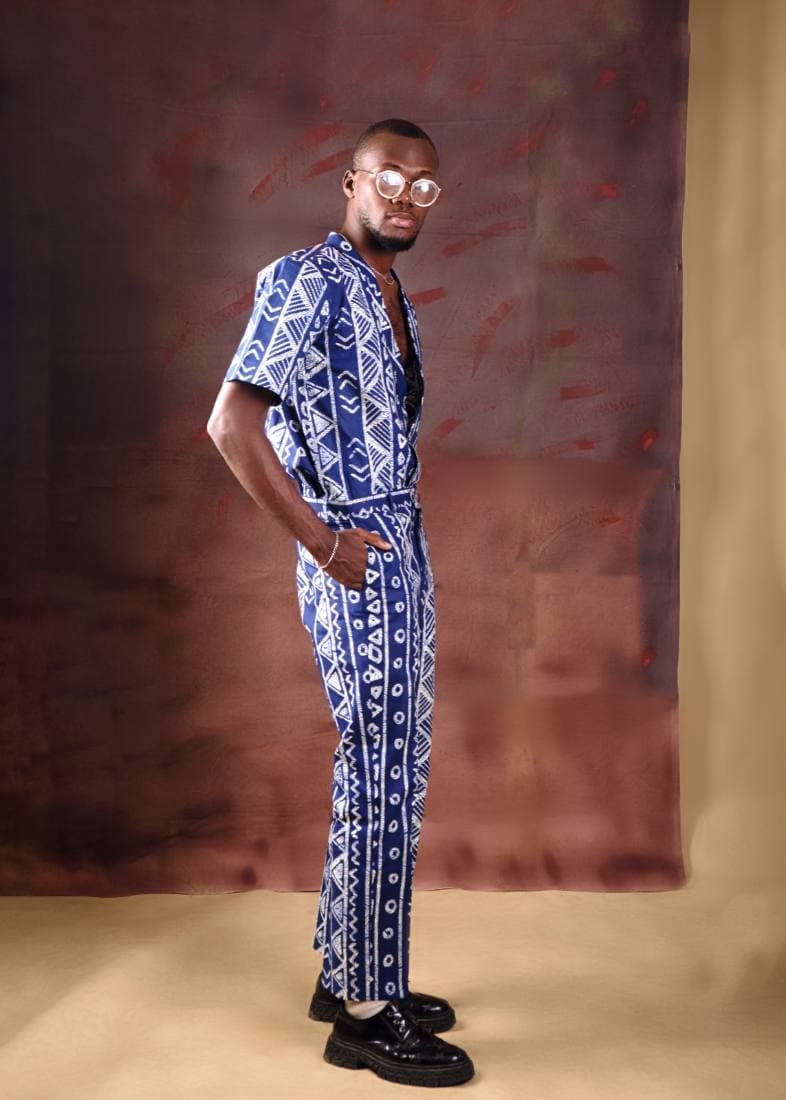 Man in a blue and white adire-print two-piece