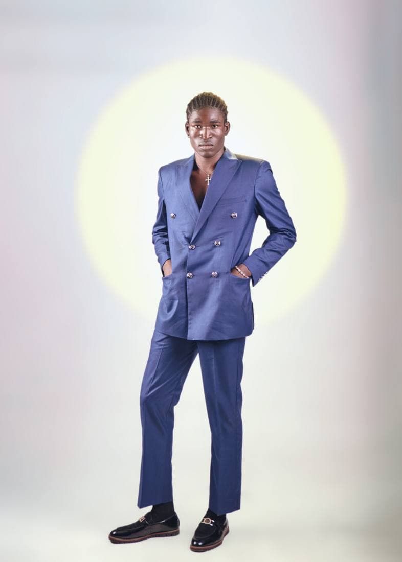 Man in a tailored navy double-breasted suit